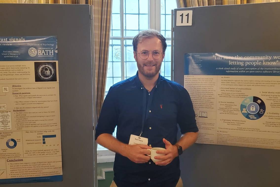 Rob Peace with posters of his recent PhD research
